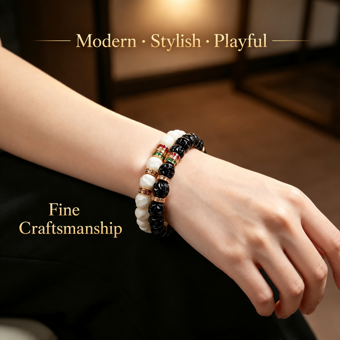 Black and white sculpted bracelets worn together on a wrist