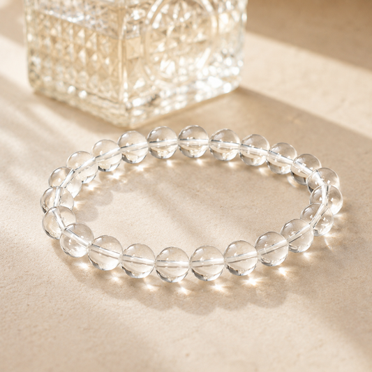 7A Natural Clear Quartz Bracelet – 8mm – diagonal glass-bottle still life
