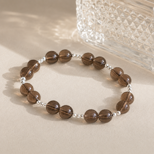 7A Natural Smoky Quartz Bracelet – 8mm – diagonal glass-bottle still life