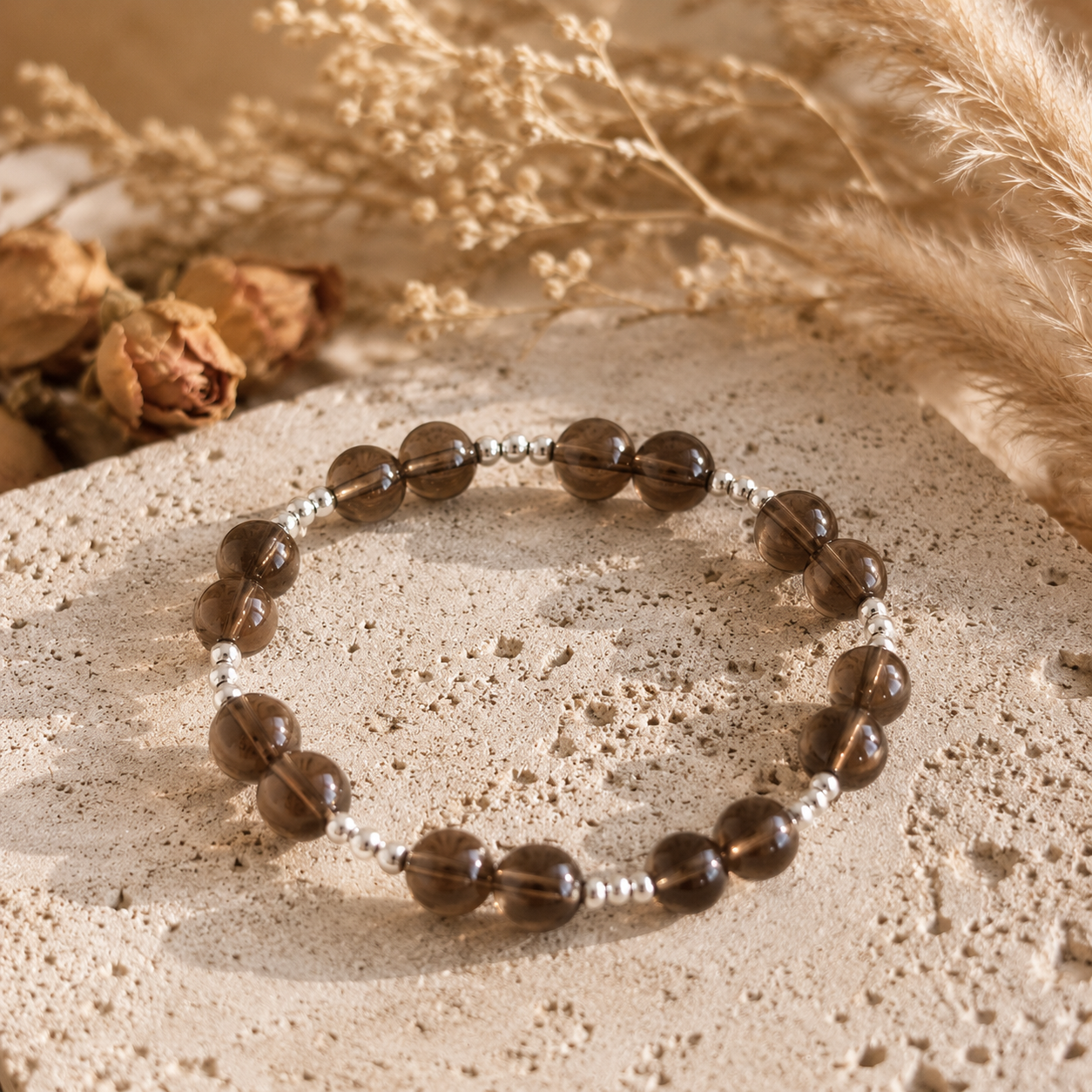 7A Natural Smoky Quartz Bracelet – 8mm – travertine and dried-flower still life