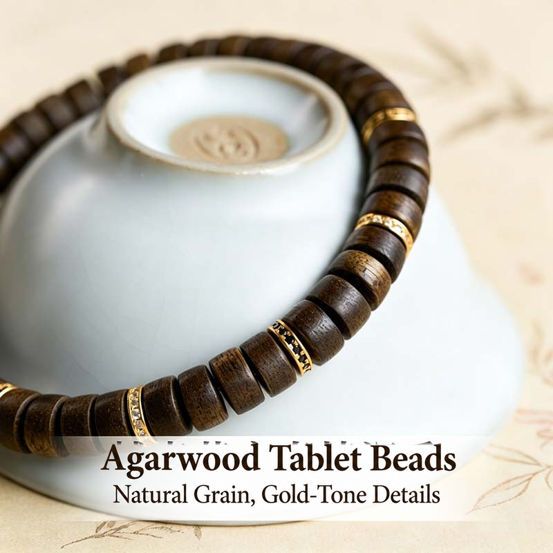 Close view of agarwood grain and gold-tone spacers