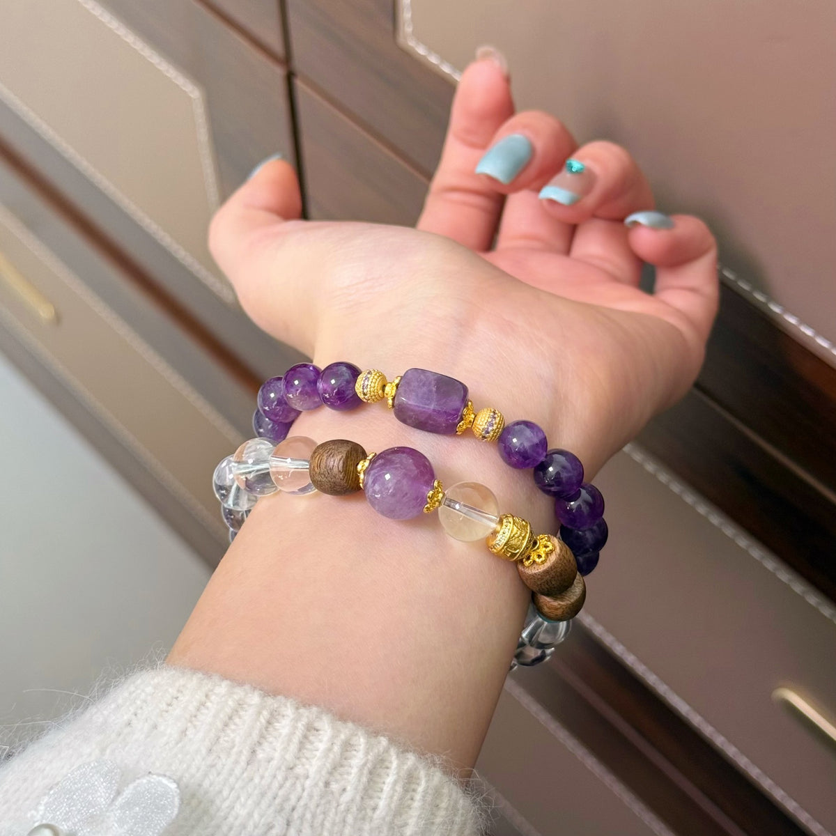 Amethyst and clear quartz bracelet styles worn on wrist