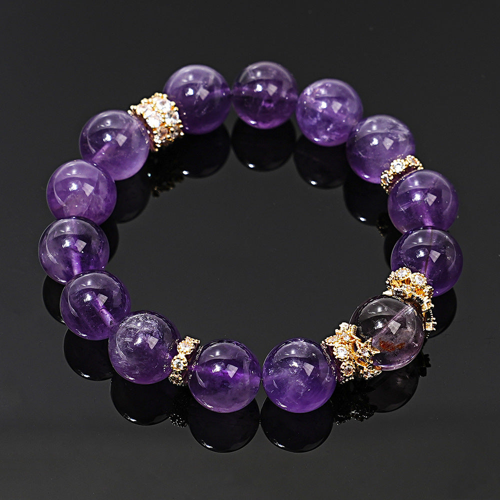 Angled view of amethyst beads and decorative center bead