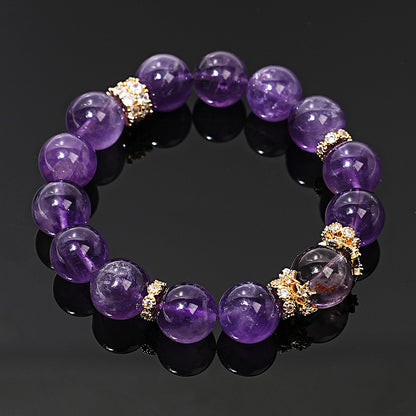 Angled view of amethyst beads and decorative center bead