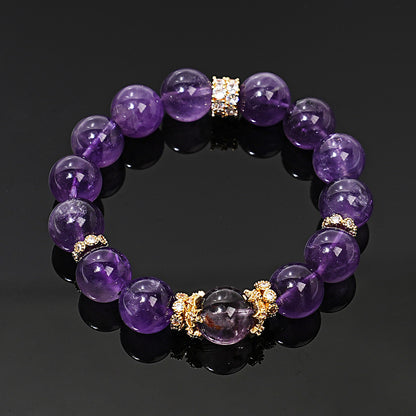 Front view of amethyst bracelet with gold-tone copper alloy accents