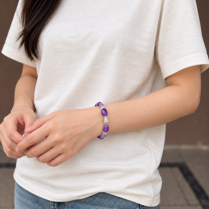 Amethyst and Shoushan bracelet worn with a white T-shirt, front wrist view