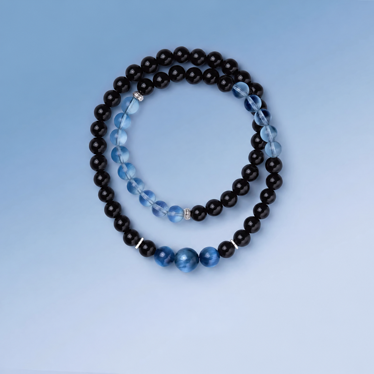 Aquamarine and obsidian double-wrap bracelet bead and design detail