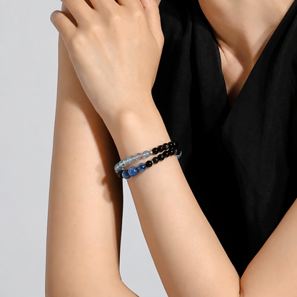 Aquamarine and obsidian double-wrap bracelet worn on the wrist