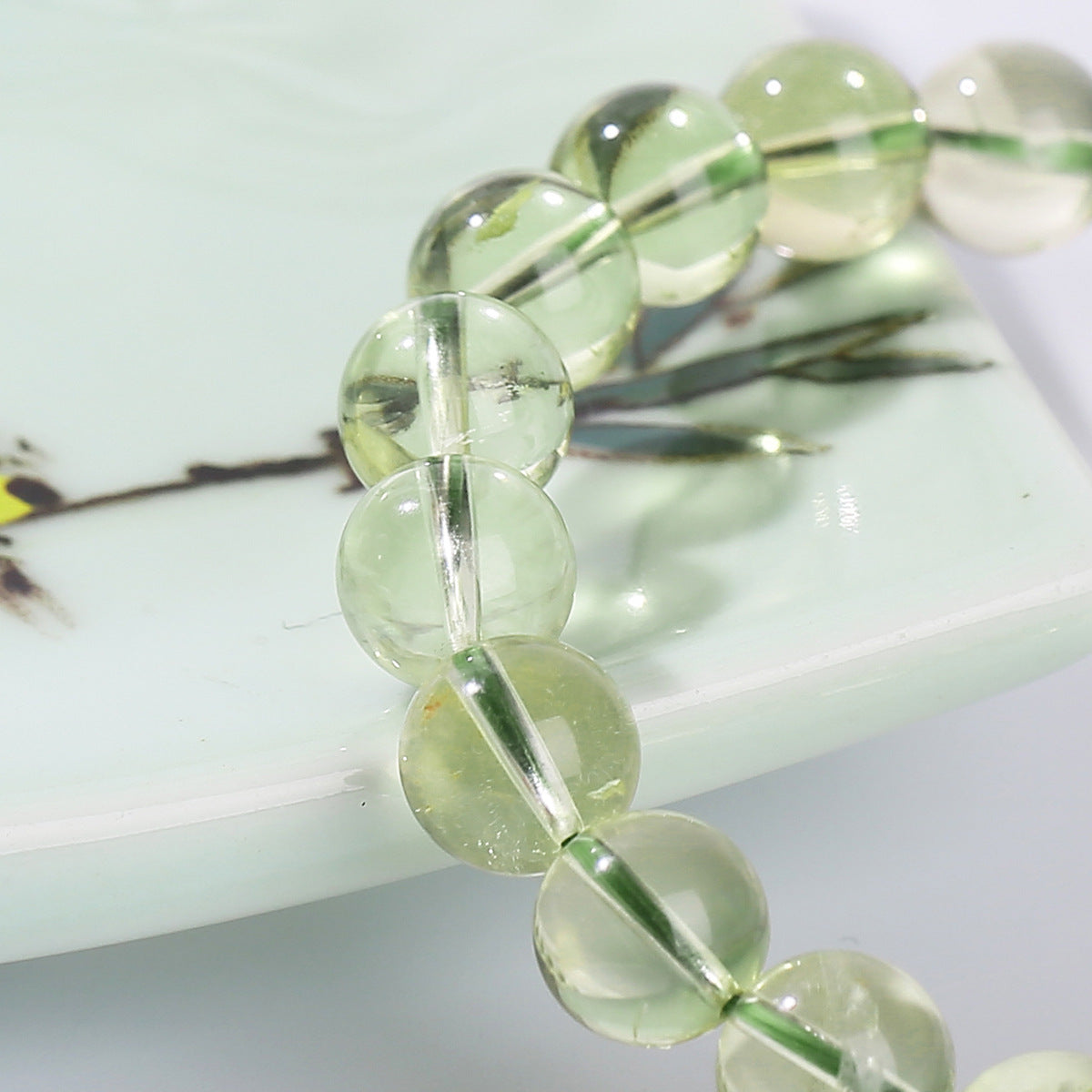 Pale green crystal bead texture close-up
