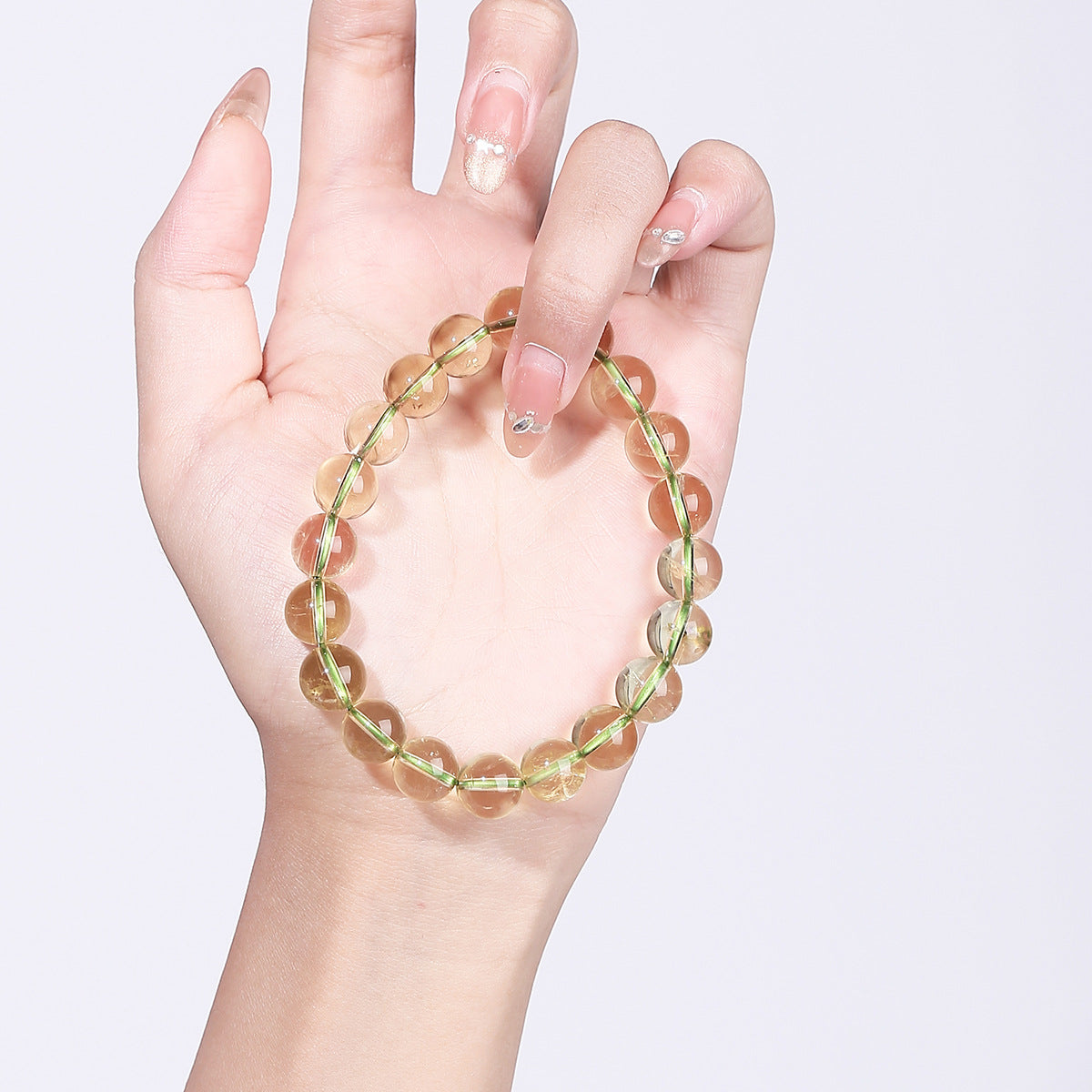 Bamboo green crystal bracelet photographed in hand