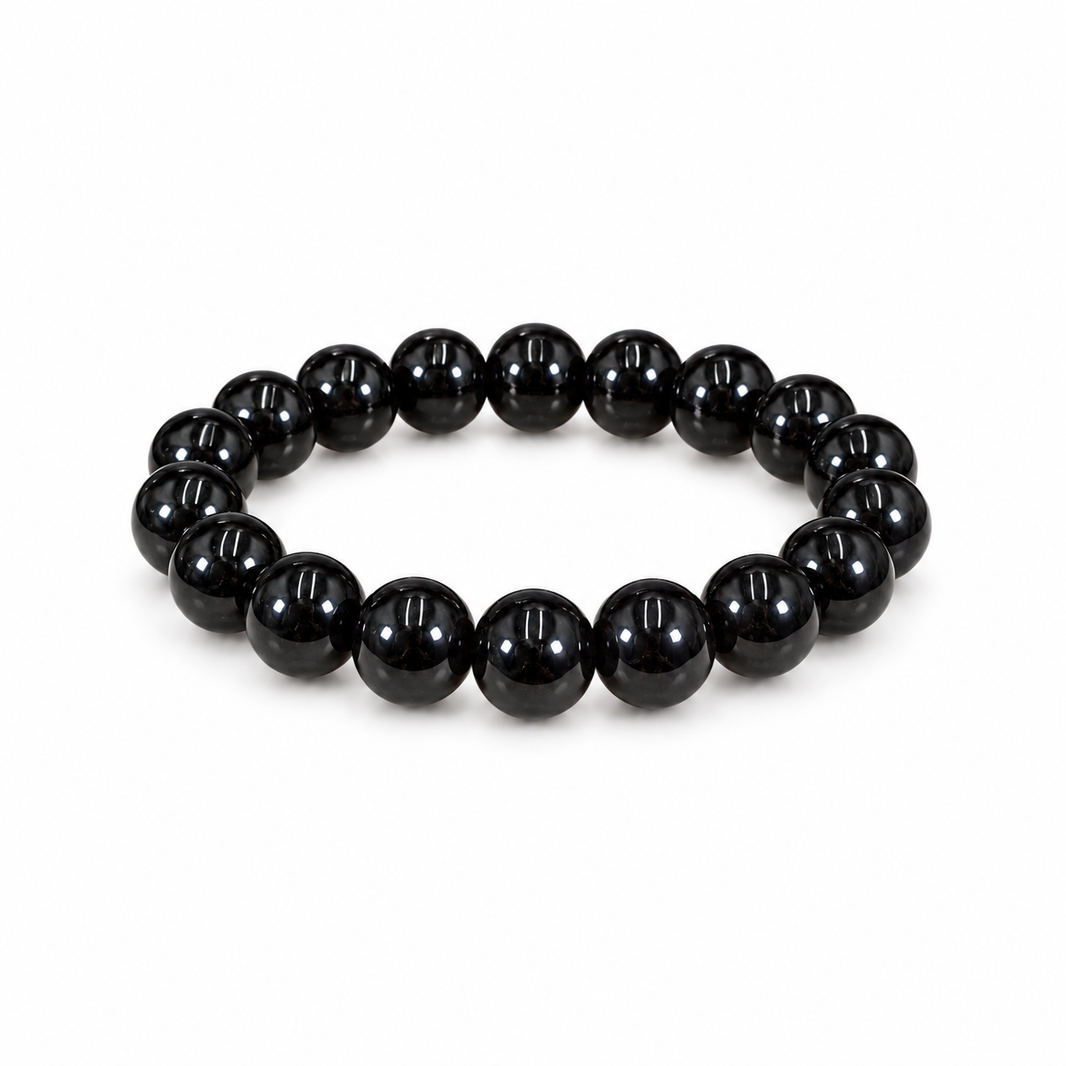 Polished black tourmaline bead bracelet on white
