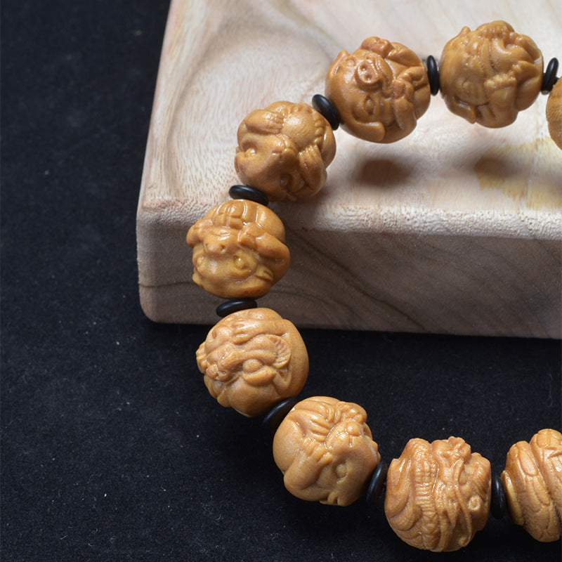 Sandalwood zodiac bracelet – carved bead detail