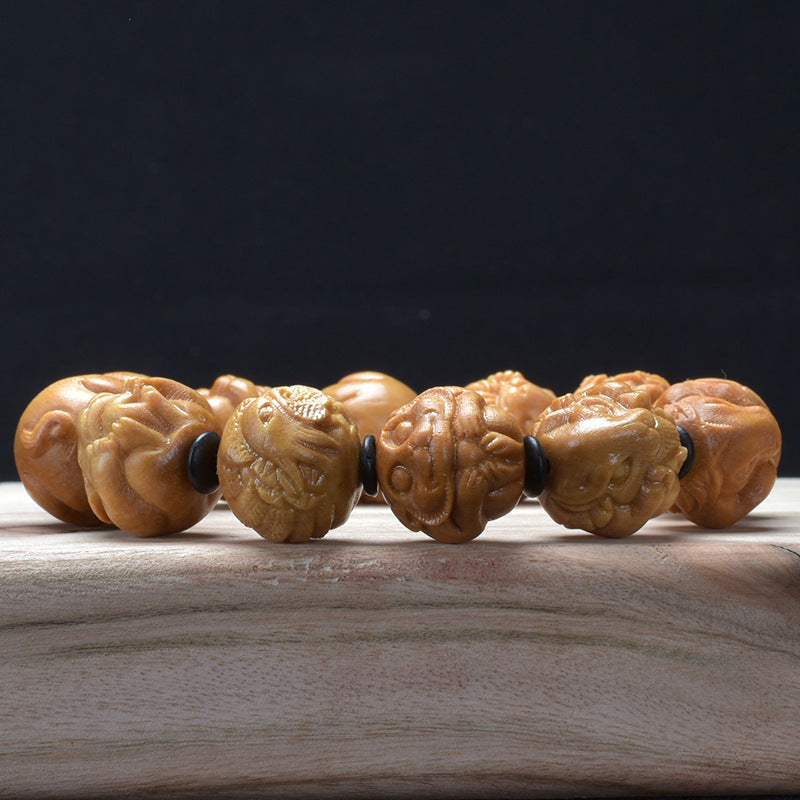 Sandalwood zodiac bracelet – low angle carving detail