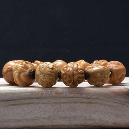 Sandalwood zodiac bracelet – low angle carving detail