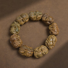 Green Wood Pixiu Holding a Ball