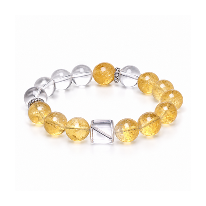 Citrine and clear quartz bracelet with cube bead on white background