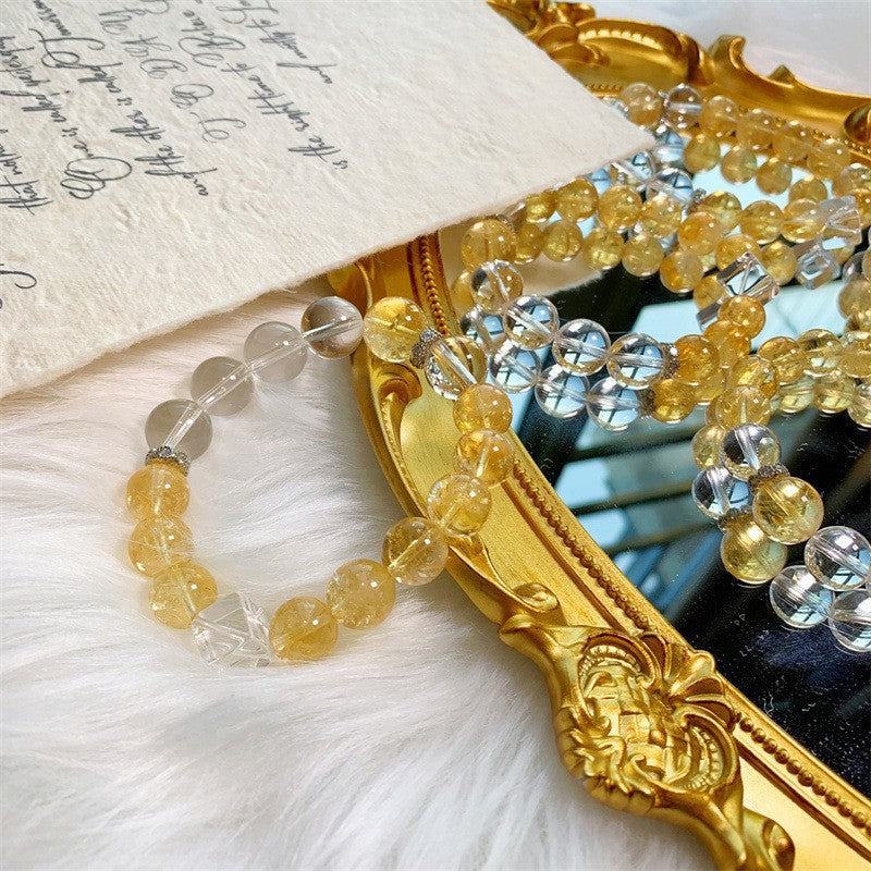 Citrine and clear quartz cube bead bracelet on a mirror