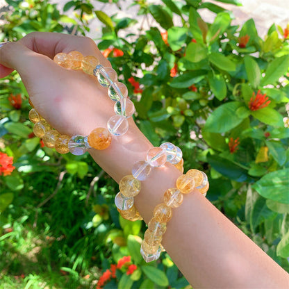 Citrine and clear quartz bracelet worn outdoors
