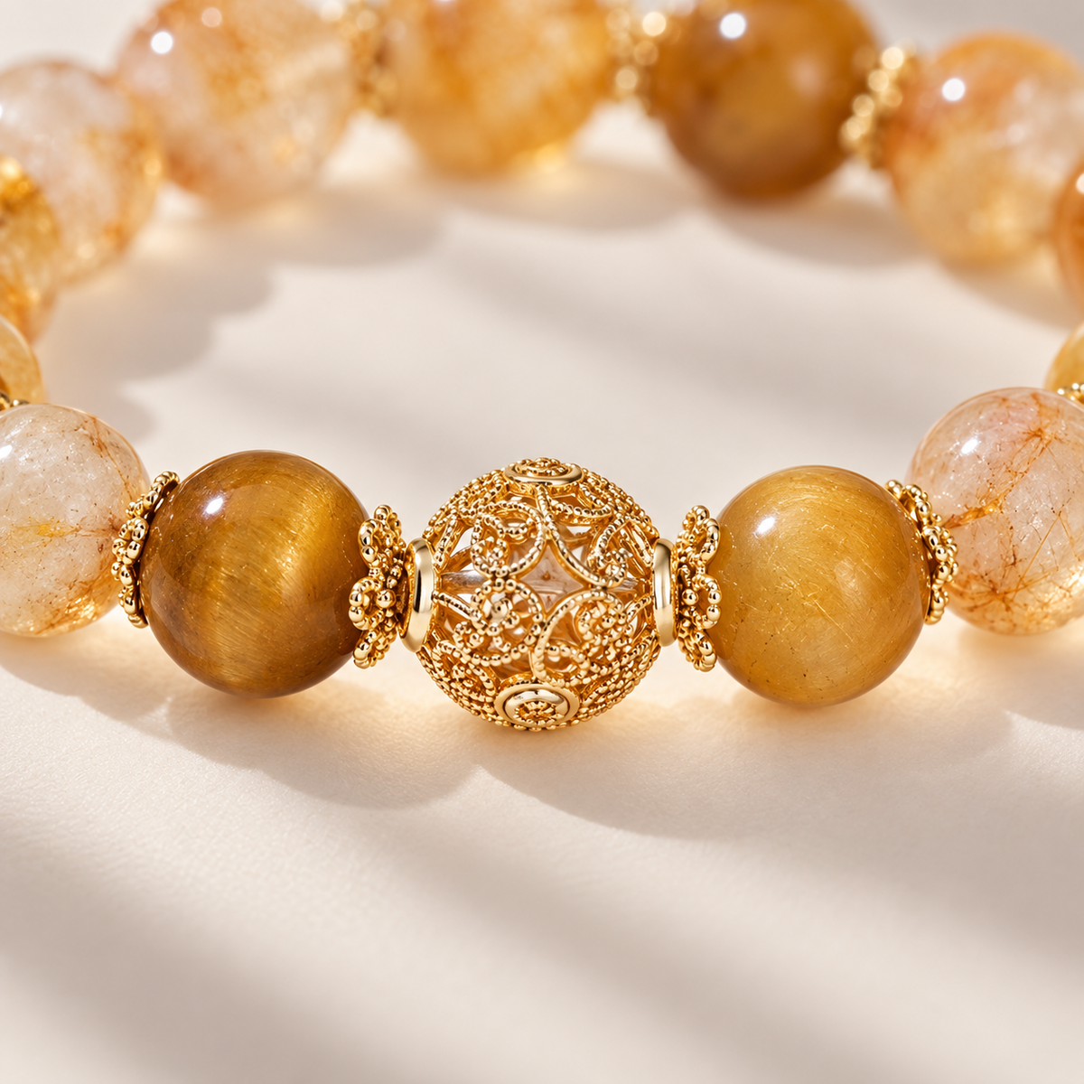 Close-up of gold-tone filigree center and stone beads
