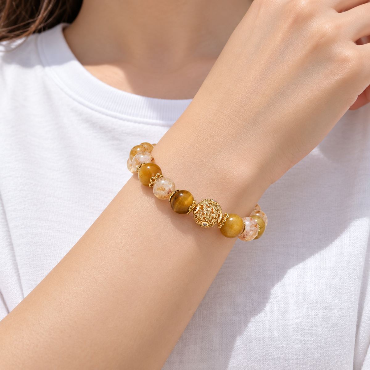 Citrine and tiger eye bracelet worn with a white shirt