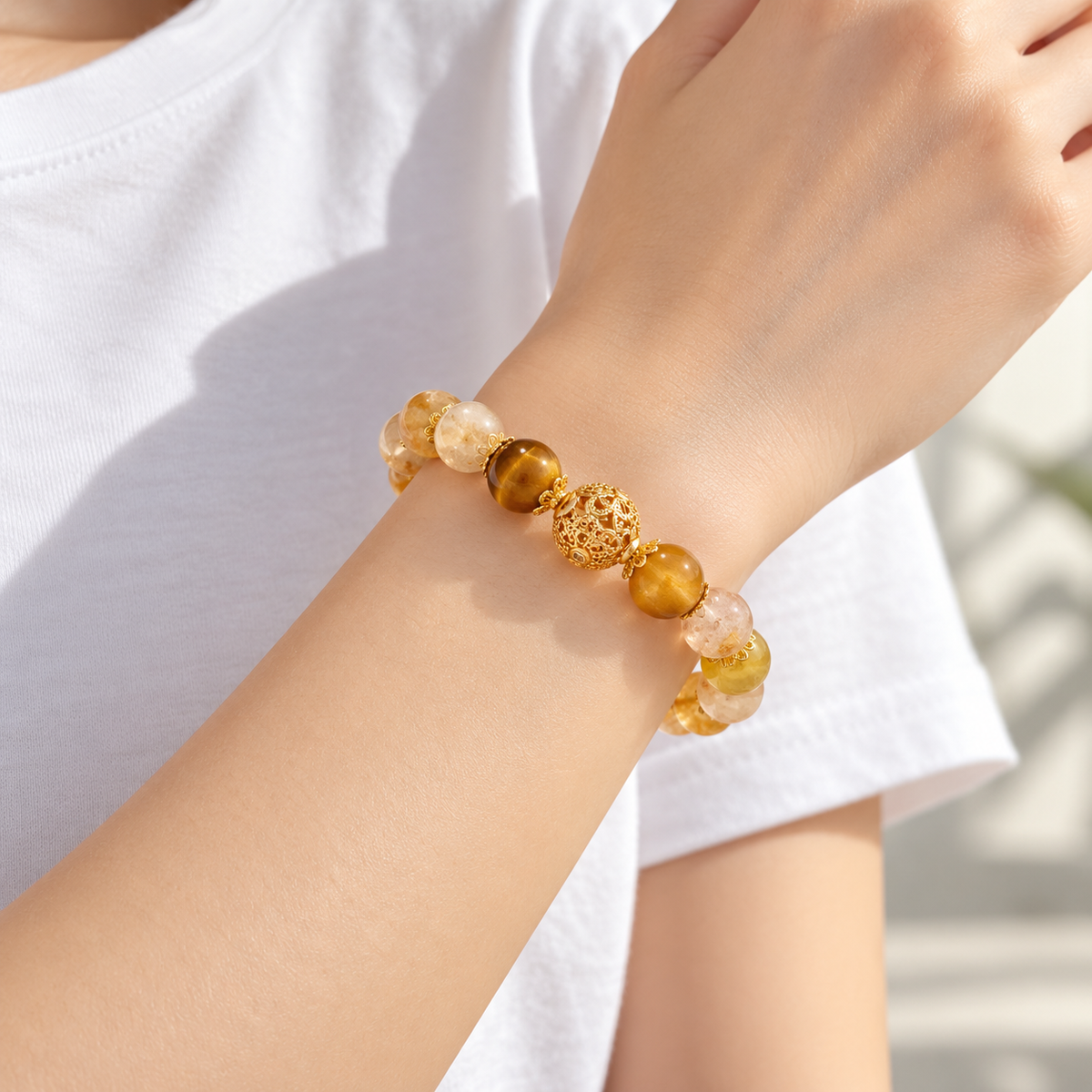 Side view of citrine and tiger eye bracelet on wrist