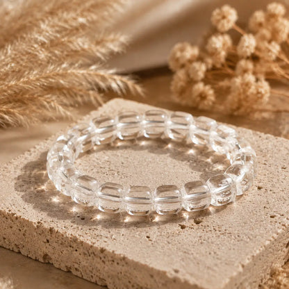 7A Clear Quartz Barrel Bead Bracelet – travertine and dried-flower still life
