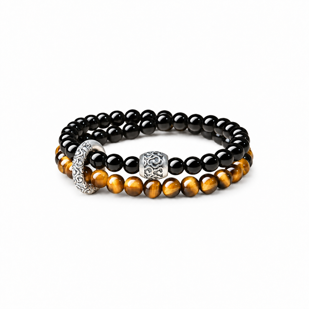 Obsidian and tiger eye double-wrap bracelet with cloud-pattern accents on white background