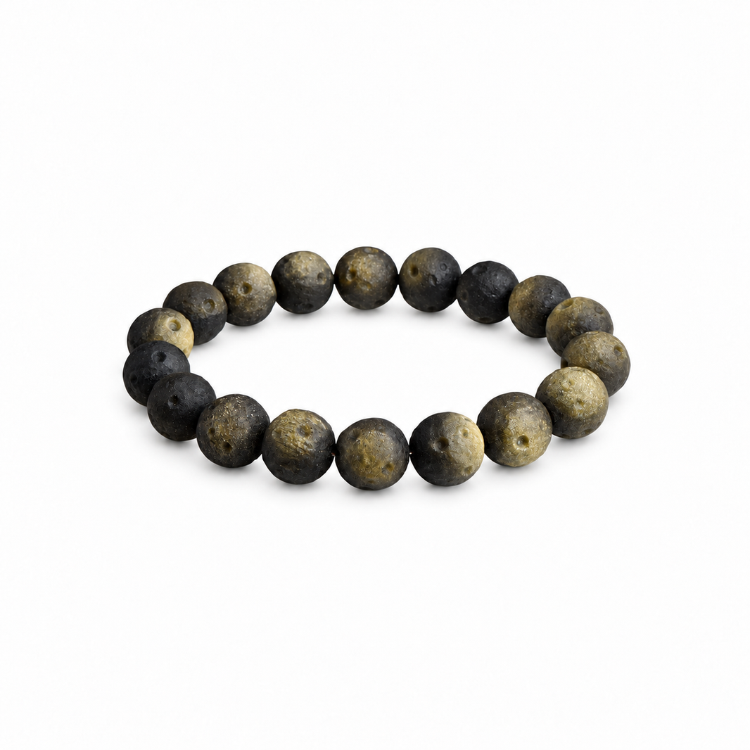 Gold sheen crater-textured obsidian bracelet on white