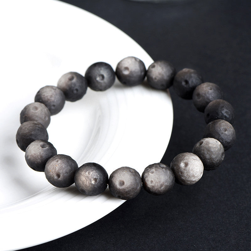 Crater-textured obsidian bracelet original silver sheen photograph