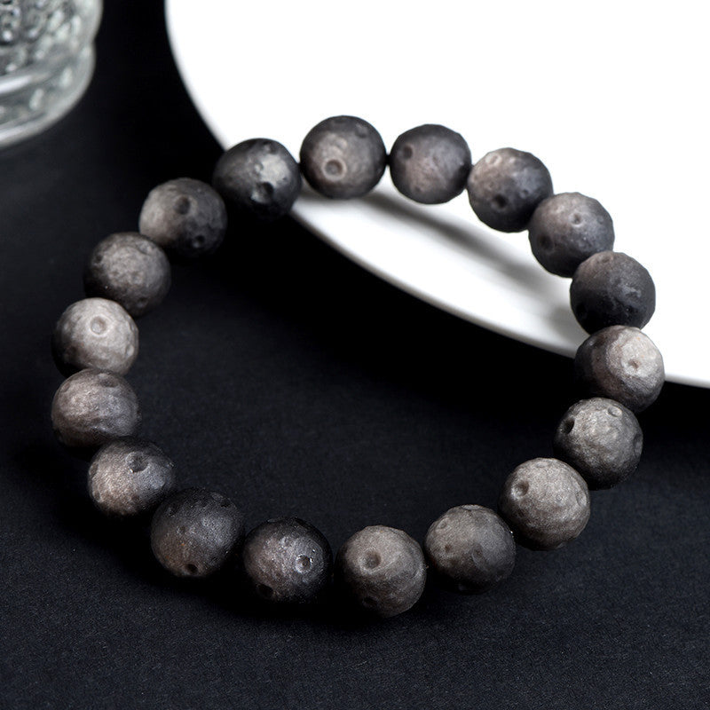 Crater-textured obsidian bracelet original silver sheen photograph