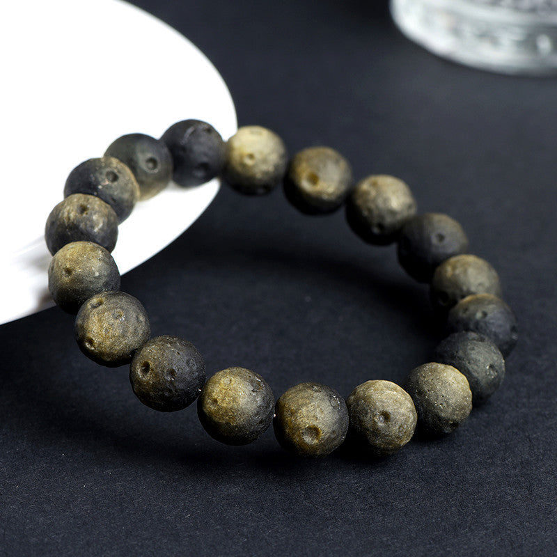Crater-textured obsidian bracelet original gold sheen photograph