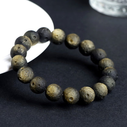 Crater-textured obsidian bracelet original gold sheen photograph