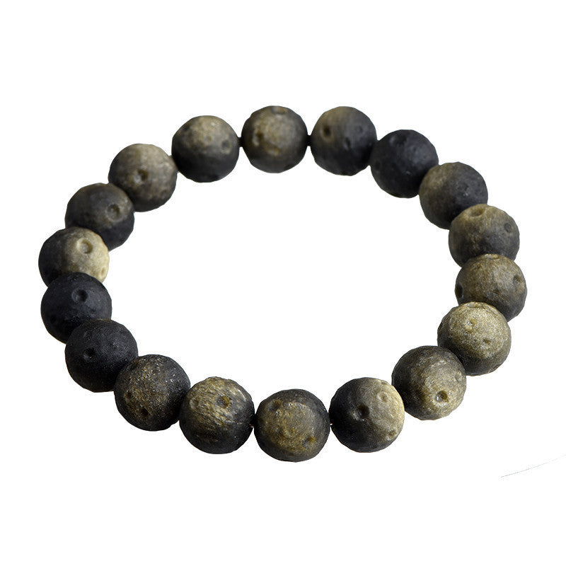 Crater-textured obsidian bracelet original gold sheen photograph