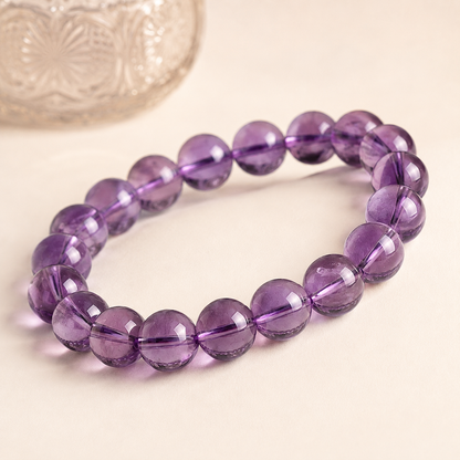 Natural light amethyst bracelet styled with a vintage glass accent