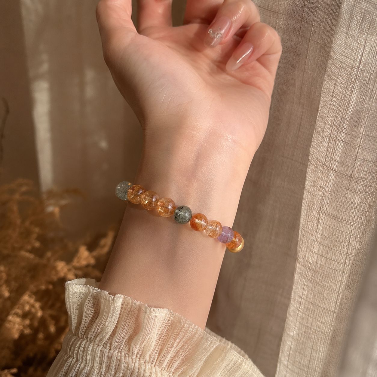Natural golden crystal bracelet wrist view in warm daylight