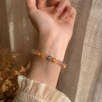 Natural golden crystal bracelet wrist view in warm daylight