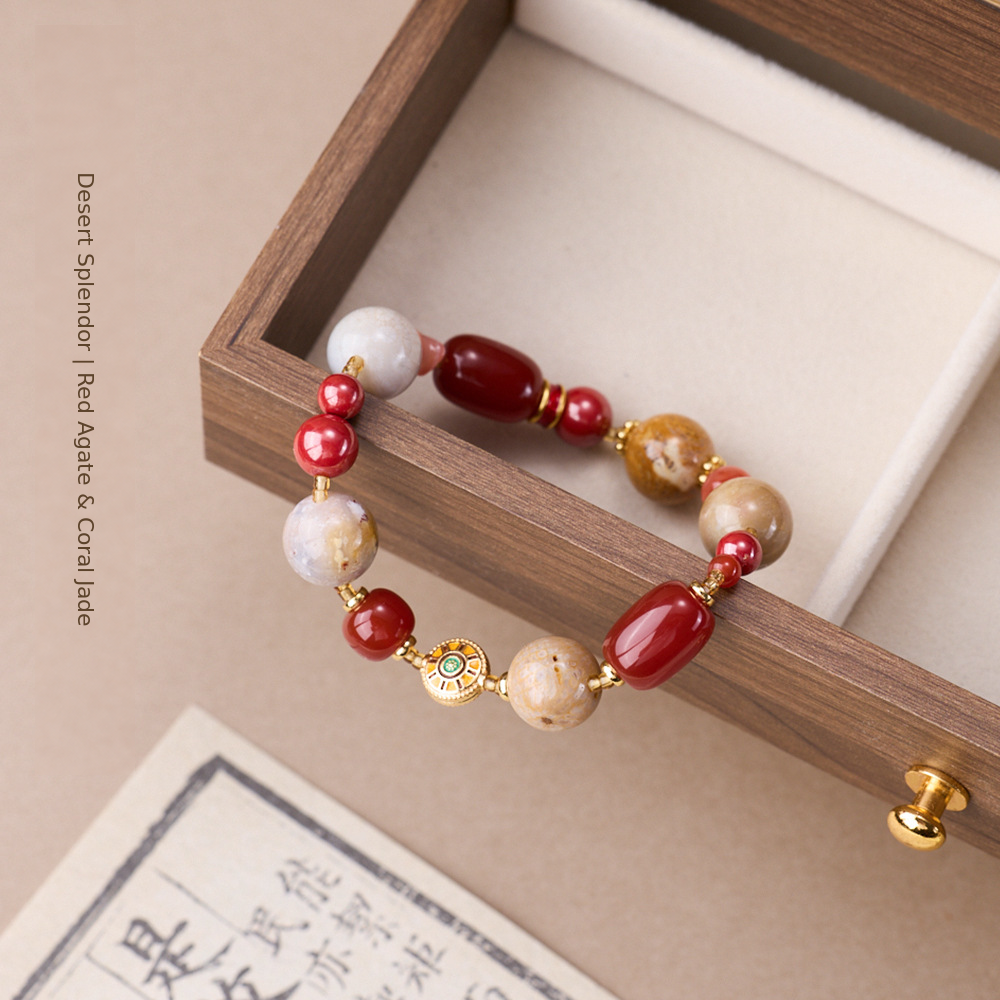 Red agate bracelet showing coral jade patterns and gold-tone spacers
