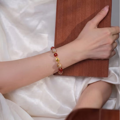 Cherry red mixed bead bracelet worn on the wrist