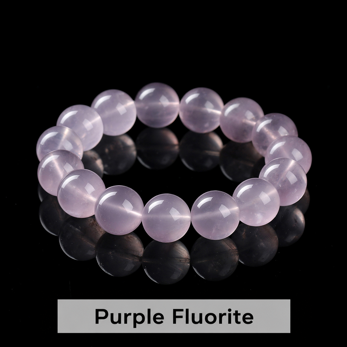 Round bead bracelet showing its polished surface and internal patterns