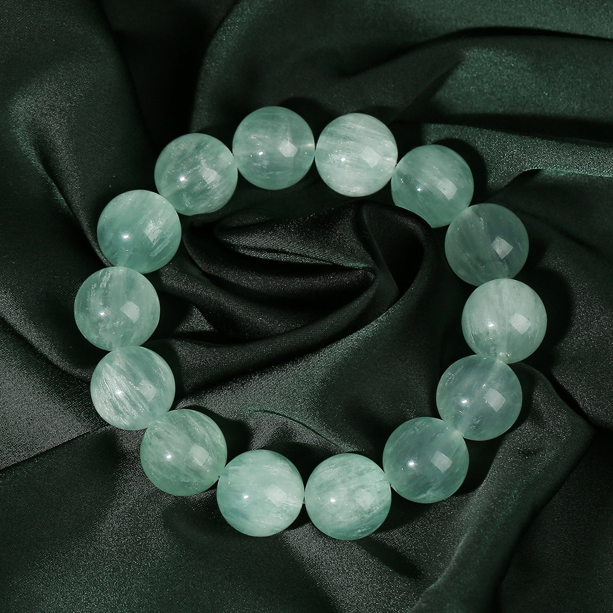 Round bead bracelet showing its polished surface and internal patterns