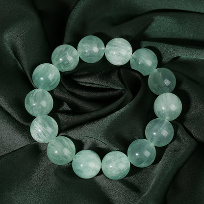Round bead bracelet showing its polished surface and internal patterns