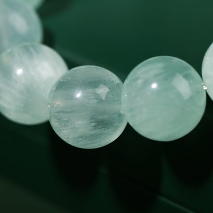 Round bead bracelet showing its polished surface and internal patterns
