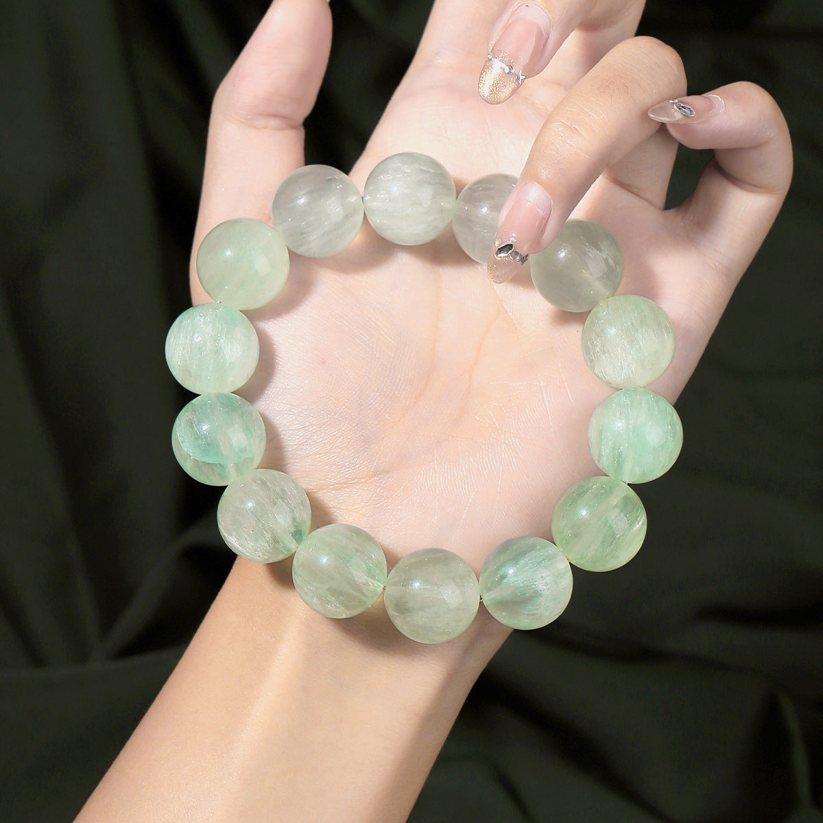Round bead bracelet showing its polished surface and internal patterns