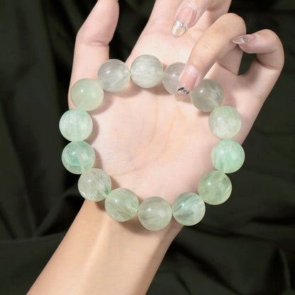 Round bead bracelet showing its polished surface and internal patterns