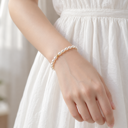 Freshwater teardrop pearl bracelet worn with a white outfit