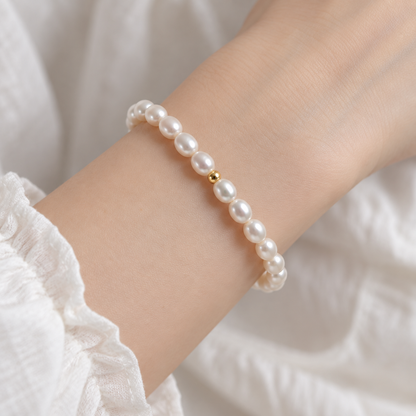 Close wrist view of the freshwater pearl stretch bracelet