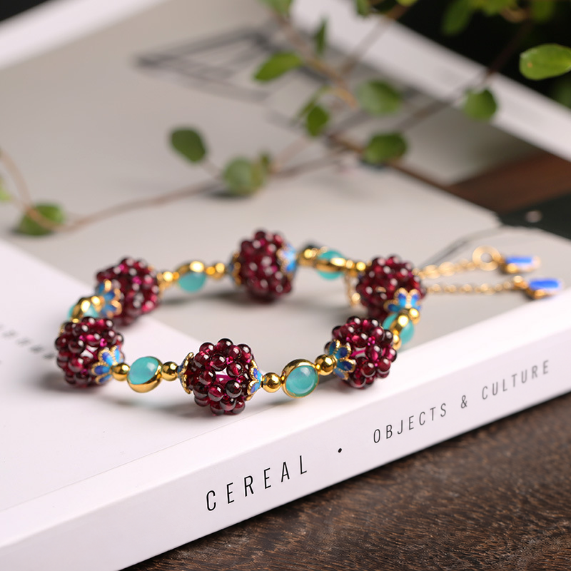 Amazonite garnet cluster bracelet on a book with English spine text
