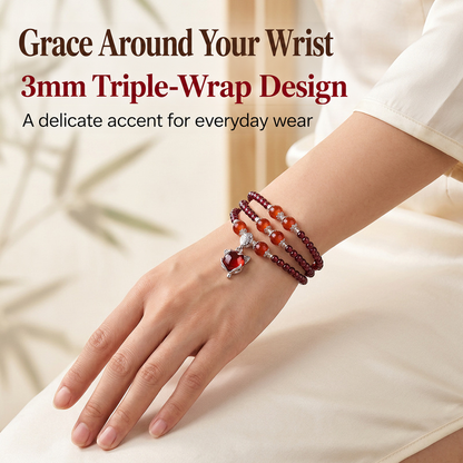 3mm garnet triple-wrap bracelet worn on a wrist