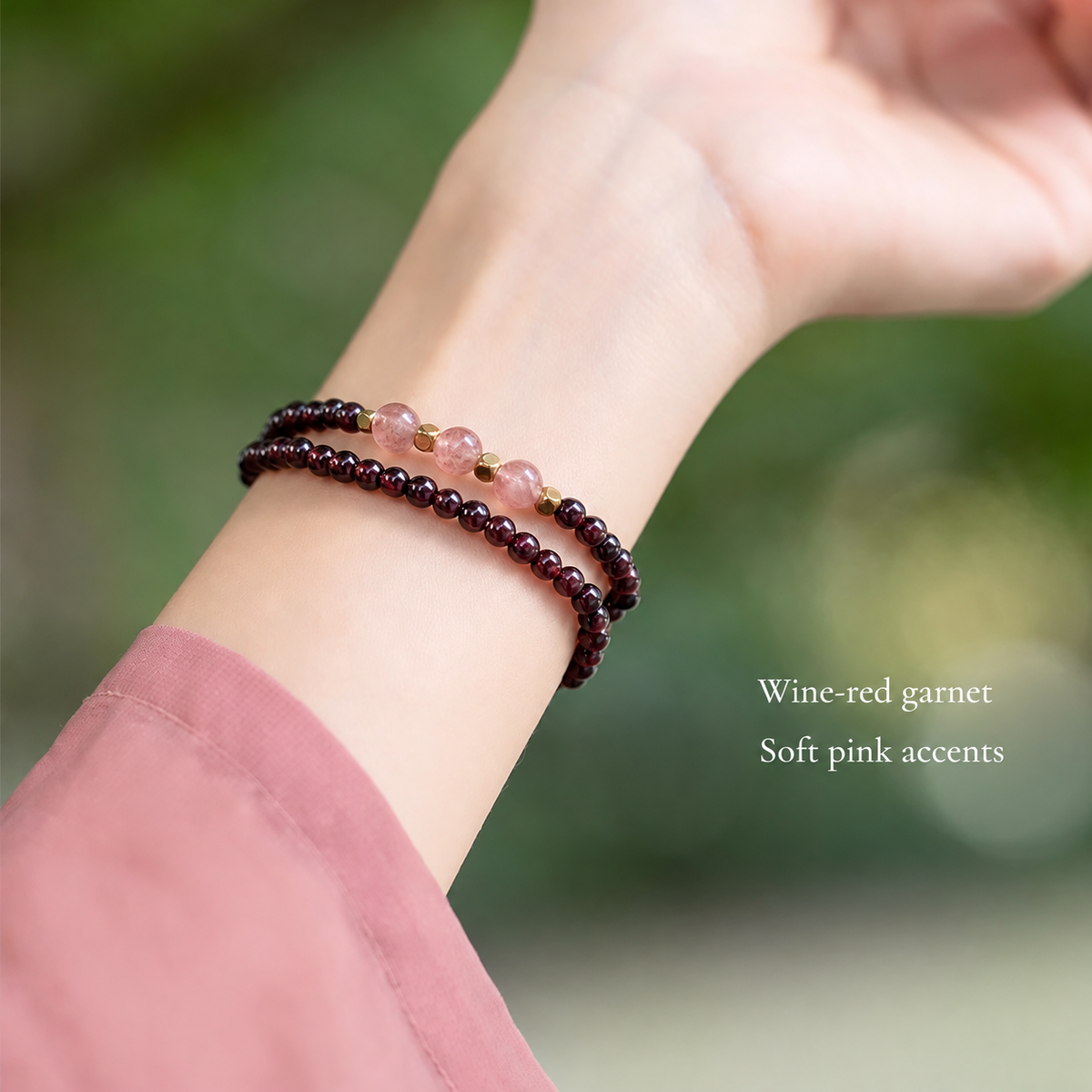 Double wrap garnet bracelet worn on wrist