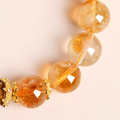 Close-up of golden crystal beads and gold-tone spacers
